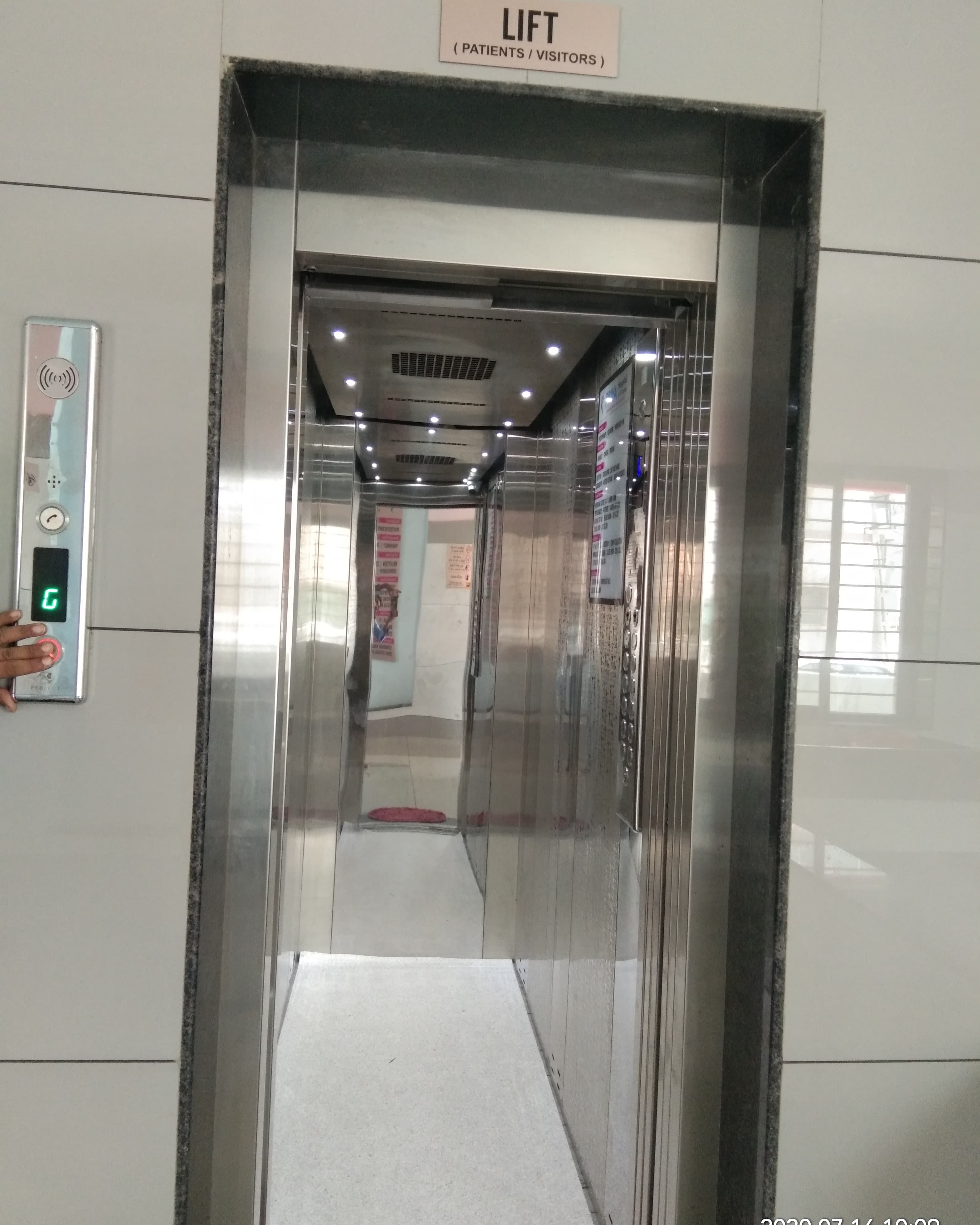 Elevator cabin with patterned walls and floor